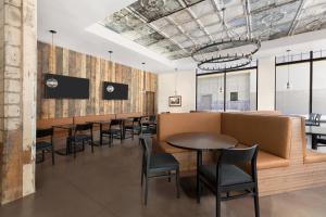 a restaurant with tables and chairs in a room at Residence Inn by Marriott Missoula Downtown in Missoula