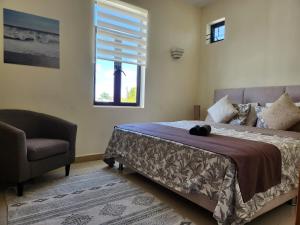 Ένα ή περισσότερα κρεβάτια σε δωμάτιο στο Penthouse vue mer avec rooftop