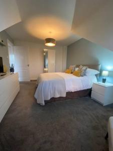 a bedroom with a large bed in a room at Lanfine View 1 at Loudoun Mains with Hot Tub in Newmilns