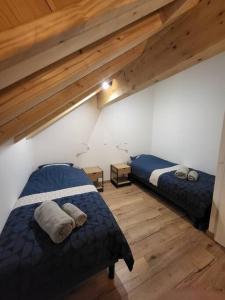 A bed or beds in a room at Maison au coeur des montagnes de l'Oisans