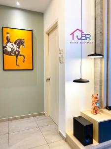 a room with a picture of a horse on the wall at JBR LUXURY HOMESTAY-ATLANTIS RESIDENCES-Near Jonker Walk-City Area-Netflix in Melaka
