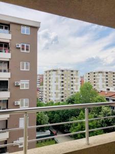 a view of a building from a balcony at Cozy Skopje Retreat in Skopje