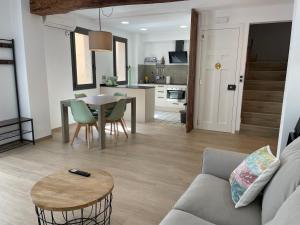 a living room with a couch and a table at ROS CENTRIC Cal Ros in Montblanc