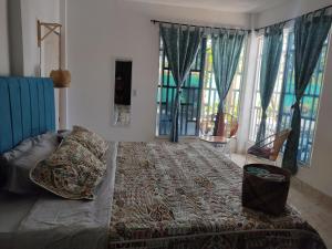 Posteľ alebo postele v izbe v ubytovaní Casa Hotel el Encanto de Carmen
