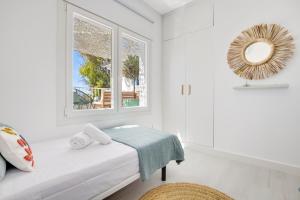 En eller flere senge i et værelse på Casa de la Playa. Beach House with magnificent sea