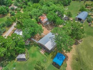 an overhead view of a house with a lot of trees at BeeWeaver Luxury Glamping - In A Meading in Navasota