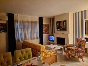 Et tv og/eller underholdning på Vera Shore 4 persons 2 pools and beach 200 m