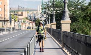 a person riding a bike on a bridge at Jardines del Ebro, 8 Pax, ideal grupos y centrico in Logroño