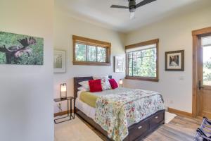 a bedroom with a bed and two windows at Cozy Fraser Cabin with Views and Moose Sightings! in Fraser