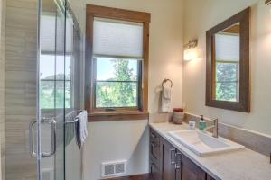 a bathroom with a shower and a sink and a glass shower backdoor at Cozy Fraser Cabin with Views and Moose Sightings! in Fraser +22 photos