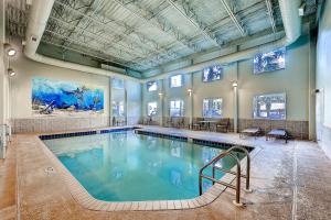 a large swimming pool in a large room at Tidewater Beach Resort by Panhandle Getaways in Panama City Beach