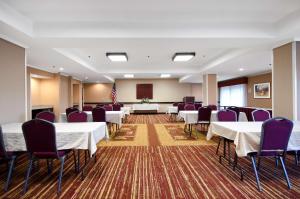 a conference room with white tables and purple chairs at Hampton Inn Asheboro in Asheboro