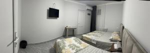 Postel nebo postele na pokoji v ubytování Hotel Amigo