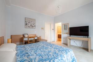 TV a/nebo společenská místnost v ubytování Riva Vieste Suites