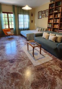 a living room with a couch and a table at Casa Grazia in Selargius