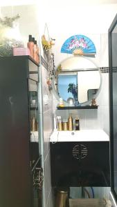 a bathroom with a sink and a mirror at chambre sur Muret in Muret