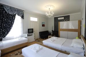 Postel nebo postele na pokoji v ubytování ApartHotel RioNi