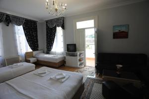 Postel nebo postele na pokoji v ubytování ApartHotel RioNi