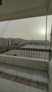 a bench on a building with a view of a city at شقه فاخره بمدينه نصر امام سيتى ستارز in Cairo