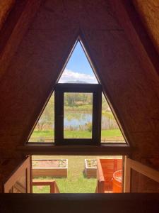 a view of a window in a roof at Sítio CRIA - Hospedagem Sustentável & Experiências Rurais in Três Coroas