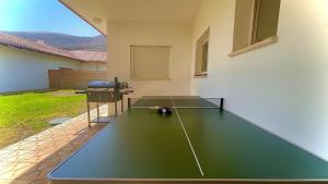 a ping pong table in the middle of a house at וילת שגיא - חופשה כפרית ליד הכנרת - Sagi Villa in Yavneʼel