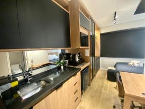 A cozinha ou cozinha compacta de loft luxuoso Home & Lifestyle Ibirapuera. N.946