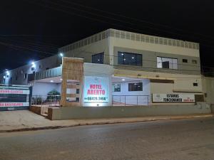 a building with signs in front of it at night at Maper Park Carajás in Parauapebas