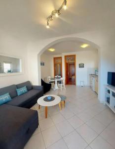 a living room with a couch and a table at Apartments Marita in Ston