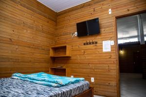 TV a/nebo společenská místnost v ubytování Pousada Tio Bilia