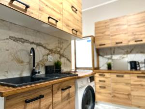 Kuchyň nebo kuchyňský kout v ubytování MMRent Lady Blue Room