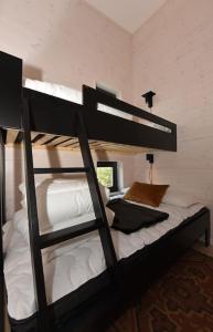 Кровать или кровати в номере Timmerby Lodge - Lindvallen Sälen - Ski in Ski out