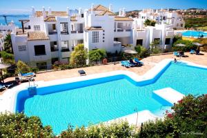 an image of a swimming pool at a villa at Apartment Marina Alcaidesa 2 beds Golf & Beach in La Alcaidesa