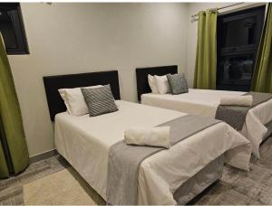 מיטה או מיטות בחדר ב-Chuumba Villas