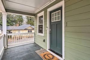 a green house with a door on a porch at Private Oasis (1bdr/1bth) AVIS Discount Available in Atlanta