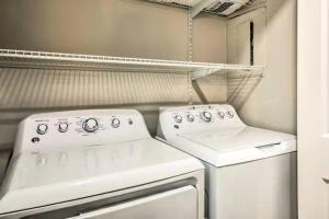 a kitchen with a stove and a washer and dryer at Private Oasis (1bdr/1bth) AVIS Discount Available in Atlanta