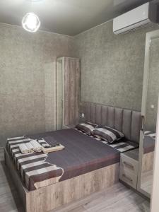 a bedroom with a large bed in a room at Villa Platinum in Tskaltubo