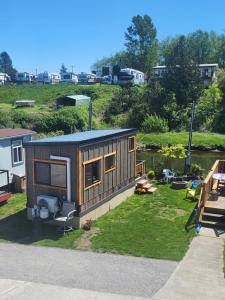 a tiny house sitting on top of a yard at Tiny Home By The Beach in Blaine