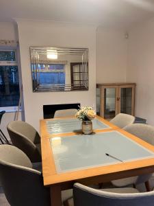 a dining room with a table and chairs at 17 Howard Road. Southampton in Southampton