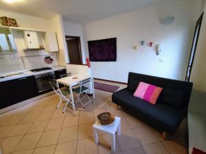 a living room with a couch and a table at Home4You in Cremona