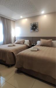 Katil atau katil-katil dalam bilik di SERPYL Plaza Hotel