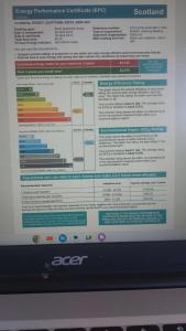 un écran d'ordinateur portable avec la page de connexion dessus dans l'établissement Mortlach Cottage, à Dufftown 2 autres photos
