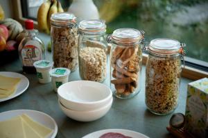a table topped with jars of nuts and other ingredients at Nuit Blanche in Oud-Heverlee