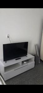 a flat screen tv sitting on top of a white entertainment center at Tone in Trilj
