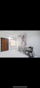 a bedroom with a bed and a bench in it at Kaf lag apartment in Lekki