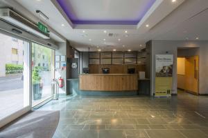 a lobby of a store with a counter in a building at Hilton Garden Inn Bristol City Centre in Bristol