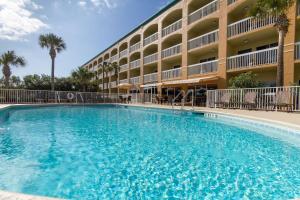 a large swimming pool in front of a hotel at Hampton Inn Saint Augustine Beach in Saint Augustine Beach