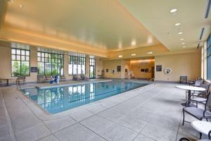 a large swimming pool in a large building at Homewood Suites Dulles-International Airport in Herndon