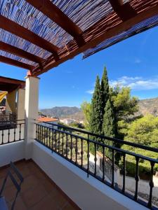 a balcony with a view of the mountains at Casa Luna in Lentegí