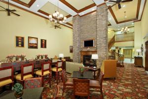 a lobby with a waiting room and a fireplace at Homewood Suites by Hilton Houston-Woodlands-Shenandoah in The Woodlands