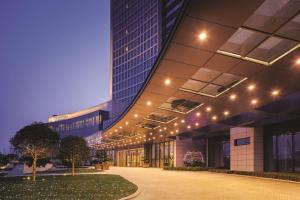 a large building with lights on the side of it at DoubleTree By Hilton Anhui in Suzhou